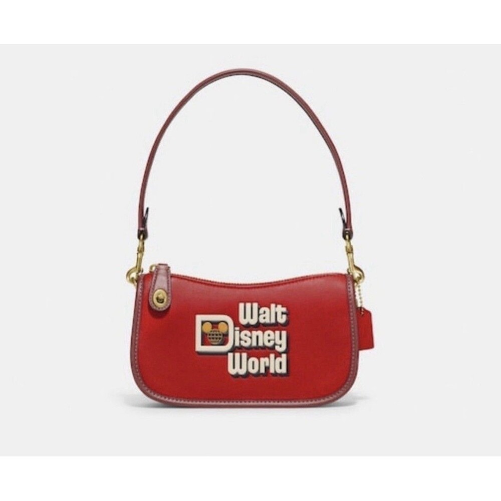 DISNEY X COACH SWINGER 20 WITH WALT DISNEY WORLD MOTIF ELECTRIC RED ULTRA RARE